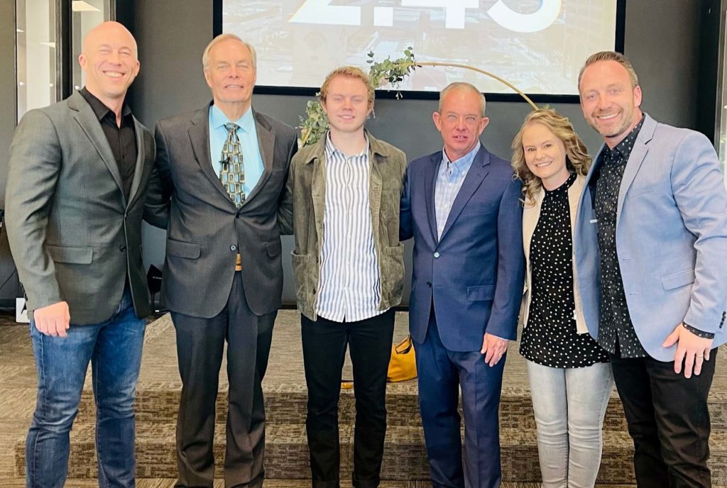 Josh Terradez smiling while standing with the group of people who ordained and separated him into the ministry.